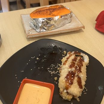Fortune House - Yami Yami Roll in the back, Dynamite Roll on the black plate. - Japanese Near Me - Burke, Virginia