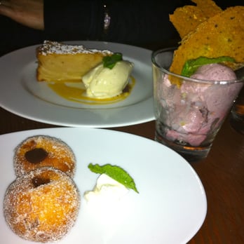 Cantinetta - Chocolate filled Zeppolinis, Blackberry gelato, and Apple Cake with caramel sauce and vanilla ice cream. - Tuscan Near Me - Seattle, Washington Cantinetta - Chocolate filled Zeppolinis, Blackberry gelato, and Apple Cake with caramel sauce and vanilla ice cream. - Tuscan Near Me - Seattle, Washington