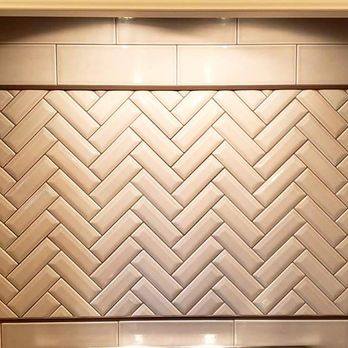 Luitjohan Flooring America - a kitchen with a stove and tile backsplash - Carpeting Near Me - Highland, Illinois Luitjohan Flooring America - a kitchen with a stove and tile backsplash - Carpeting Near Me - Highland, Illinois