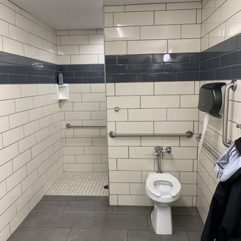 Love's Travel Stop - a bathroom with a toilet and a shower stall - Convenience Stores Near Me - Dumas, Texas Love's Travel Stop - a bathroom with a toilet and a shower stall - Convenience Stores Near Me - Dumas, Texas
