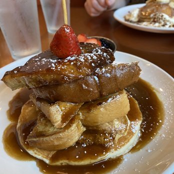 Another Broken Egg Cafe - Napoleon Temptation - a pancake, Belgian waffle, French toast and cinnamon roll French toast in their rum butter sauce. - Cafes Near Me - Orange Beach, Alabama Another Broken Egg Cafe - Napoleon Temptation - a pancake, Belgian waffle, French toast and cinnamon roll French toast in their rum butter sauce. - Cafes Near Me - Orange Beach, Alabama