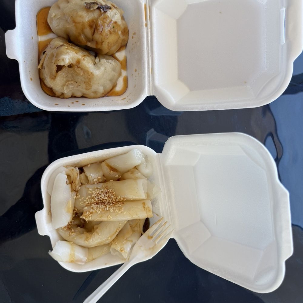 Penn fried dumplings in Hong Kong rolled flat rice noodles with peanut sauce, soy sauce, and sesame seeds
