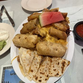 The Original Alfredos - Fiesta Platter, more than enough for two. Large portion of rice, beans and nachos under the casadias, taquitos... etc. Delicious. - Breakfast & Brunch Near Me - Lomita, California