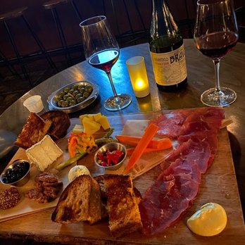 Tabula Rasa Bar - a table with a variety of food and wine - Wine Bars Near Me - Los Angeles, California Tabula Rasa Bar - a table with a variety of food and wine - Wine Bars Near Me - Los Angeles, California