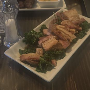 Beau Vines Steakhouse - Pork belly with kale and brown sugar sauce - Steakhouses Near Me - Ruston, Louisiana Beau Vines Steakhouse - Pork belly with kale and brown sugar sauce - Steakhouses Near Me - Ruston, Louisiana