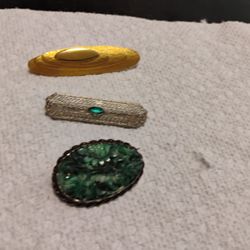 Antique pins. One is carved jade