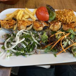 Fuego Restaurant - Chicken Kabab with onions, salad, fries and bulgar