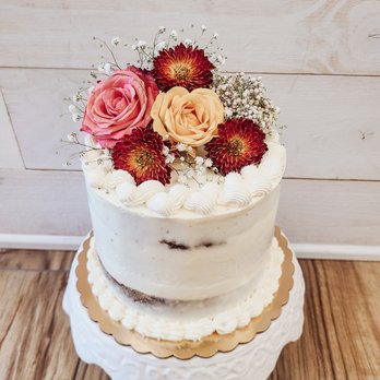 The Cake Cottage - a three tiered cake with flowers on top - Desserts Near Me - St. Cloud, Florida The Cake Cottage - a three tiered cake with flowers on top - Desserts Near Me - St. Cloud, Florida
