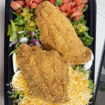 H & J Hamburgers - two chicken schnitzers on a bed of lettuce and tomatoes - Burgers Near Me - Fort Worth, Texas