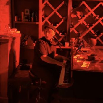 Grapes & Grains - Chris Heroldt slaying the ivories on the piano - Wine Bars Near Me - Chicago, Illinois