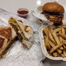 The crunchwrap, garlic fries, and smoked brisket burger