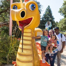 Children's Fairyland - Happy Dragon welcomes kids to climb all over his back as he lounges inside the gates.