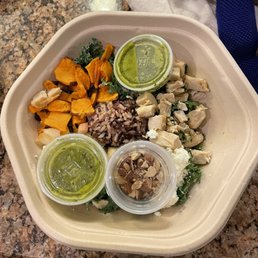 An untouched salad, half full