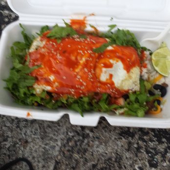 Chi'Lantro - Sorry it's a little blurry, but this from their food truck, a rice bowl with your choice of meat with fried eggs on top! - Asian Fusion Near Me - Austin, Texas Chi'Lantro - Sorry it's a little blurry, but this from their food truck, a rice bowl with your choice of meat with fried eggs on top! - Asian Fusion Near Me - Austin, Texas