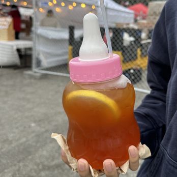 Foodieland - Mini baby bottle of passion peach iced tea - $22 with unlimited refills - Festivals Near Me - Daly City, California Foodieland - Mini baby bottle of passion peach iced tea - $22 with unlimited refills - Festivals Near Me - Daly City, California