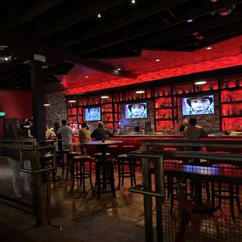 American Bites - people sitting at a bar with red lights - Bars Near Me - San Francisco, California American Bites - people sitting at a bar with red lights - Bars Near Me - San Francisco, California