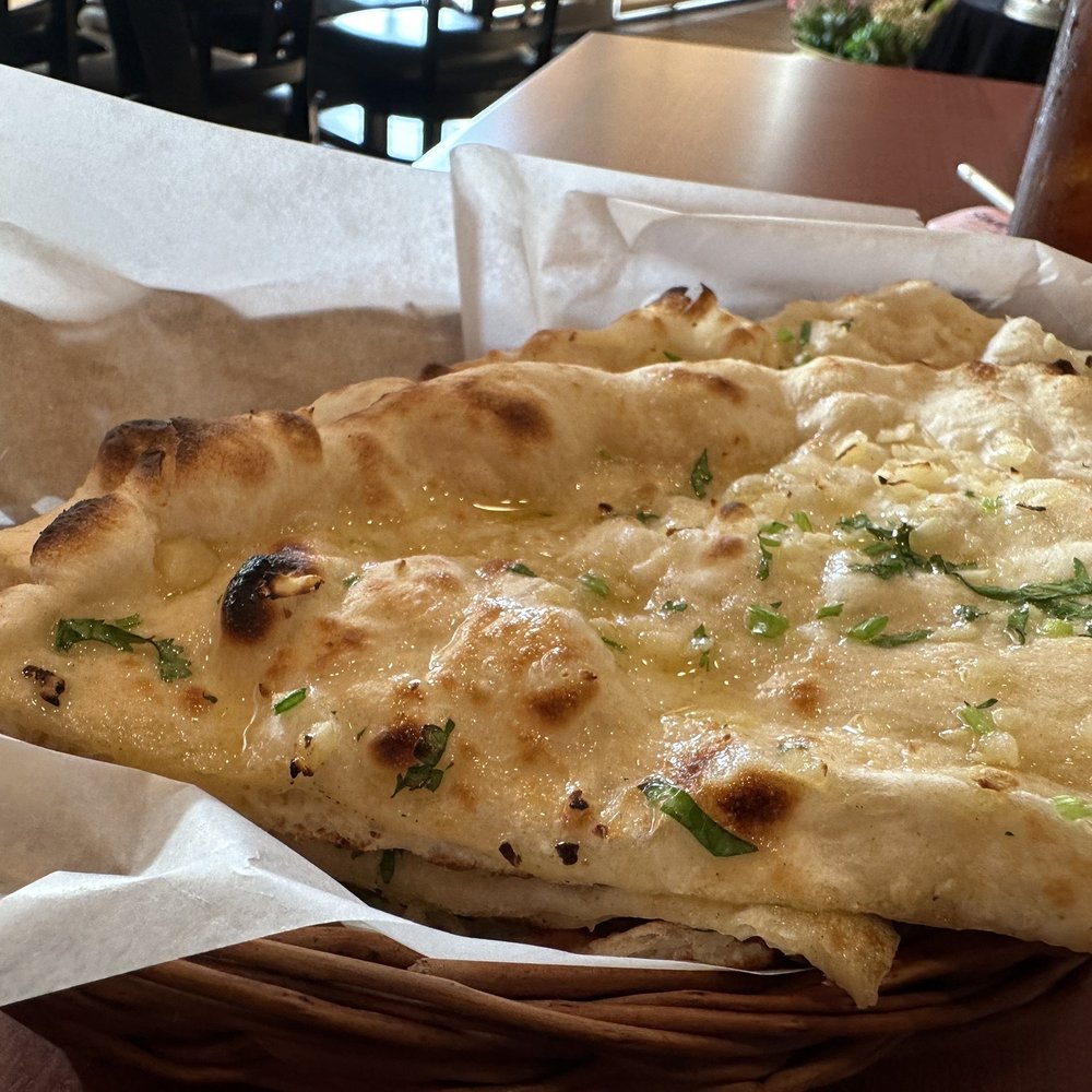 Kathmandu Curry and Bar - It's hard to capture the deliciousness of fresh garlic naan in a photo. You may just have to take my word for it. - Himalayan/Nepalese Near Me - Houston, Texas Kathmandu Curry and Bar - It's hard to capture the deliciousness of fresh garlic naan in a photo. You may just have to take my word for it. - Himalayan/Nepalese Near Me - Houston, Texas