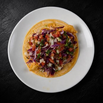 Fuego Cravings - Crispy fried fish topped with creamy chipotle sauce, fresh cabbage, and pico de gallo, all on two warm corn tortillas. - Mexican Near Me - Beaumont, California Fuego Cravings - Crispy fried fish topped with creamy chipotle sauce, fresh cabbage, and pico de gallo, all on two warm corn tortillas. - Mexican Near Me - Beaumont, California