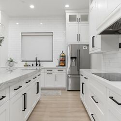 Filco Appliance Superstore - Jennair induction cooktop, Jennair counter depth fridge, Jennair microwave and oven combo on the left