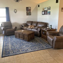 Hoelscher's Fine Furniture, Appliances, and Electronics - 2 rocking recliners, sofa, end table, and coffee table that opens toward sofa to use as TV tray.