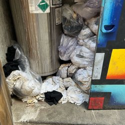 CRAFT Beer Market Edmonton - Towels and Aprons STUFFED beside a combustible gas unit for refrigeration.