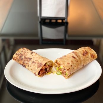 Fartun Cultural Cuisine - two burritos on a plate - African Near Me - Edmonton, Alberta Fartun Cultural Cuisine - two burritos on a plate - African Near Me - Edmonton, Alberta