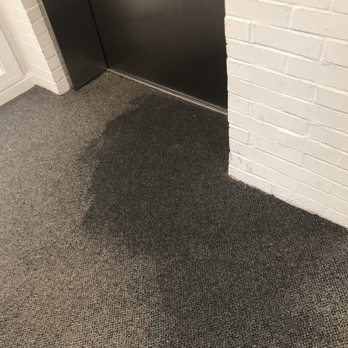 Cathedral Court - Area in front of the elevator after a heavy rain - Apartments Near Me - Baltimore, Maryland Cathedral Court - Area in front of the elevator after a heavy rain - Apartments Near Me - Baltimore, Maryland