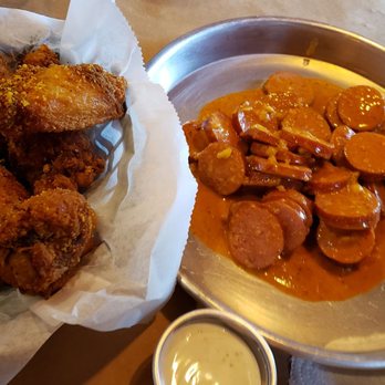 Crafty Crab - Chicken wings with a side of sauce and garlic and sausage - Seafood Near Me - Altamonte Springs, Florida Crafty Crab - Chicken wings with a side of sauce and garlic and sausage - Seafood Near Me - Altamonte Springs, Florida