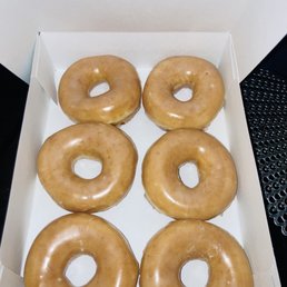 six glazed donuts in a box