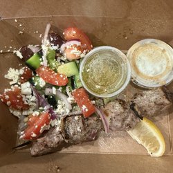 Cafe Akroteri - Kebab dinner. paid extra for the Greek salad $8 no lettuce. Dry overcooked Lamb minimal grill marks and gray all the way through. NO RICE!