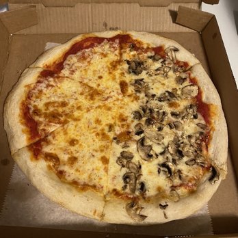Fellini's Pizza - Medium pizza with mushroom and garlic on half. This one item, with tax and 15% tip, was $20. - Pizza Near Me - Decatur, Georgia