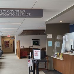 Amirah J Butler - Check in here. If you know your doctor, it is easy to find which window you check in at. It's kind of confusing if this is your first time.