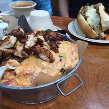 Seacrets - Jerk chicken cheesesteak and nachos. - Bars Near Me - Ocean City, Maryland Seacrets - Jerk chicken cheesesteak and nachos. - Bars Near Me - Ocean City, Maryland