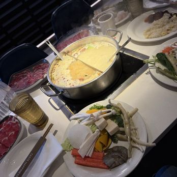 Happy Lamb Hot Pot - Half and Half Broth with our plates of veggies and seafood from the buffet. - Hot Pot Near Me - Naperville, Illinois