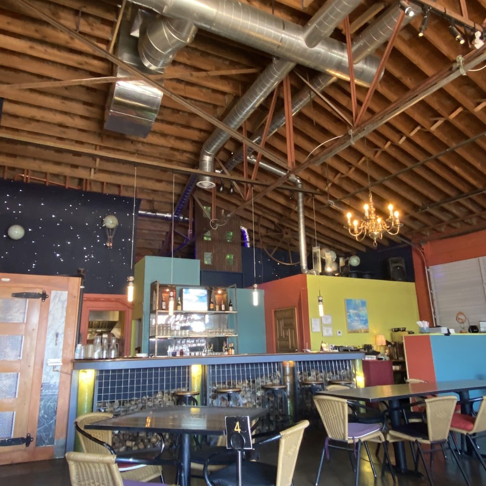The Kosmos - More interior including the bar and hostess stand. - Bars Near Me - Albuquerque, New Mexico