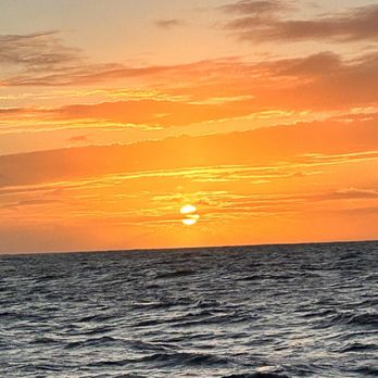 Blue Dolphin Charters - Sunset at sea on the leeward side of Kauai. - Boating Near Me - Eleele, Hawaii