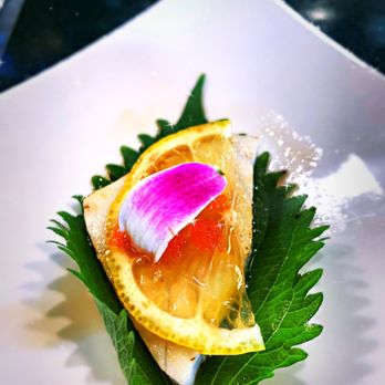 Harumi Sushi - Ono on Shizo leaf with tobiko and orchid petal. - Sushi Bars Near Me - Seaside, California Harumi Sushi - Ono on Shizo leaf with tobiko and orchid petal. - Sushi Bars Near Me - Seaside, California