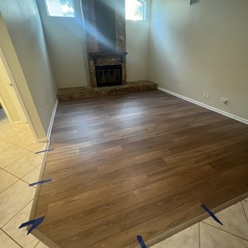 Falcon Flooring - an empty room with a fireplace - Flooring Near Me Falcon Flooring - an empty room with a fireplace - Flooring Near Me