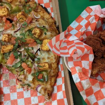 Fusion Curry Pizza - Makhani paneer pizza and tandoori wings. The wings are super crispy and spiced perfectly. - Pizza Near Me - Portland, Oregon Fusion Curry Pizza - Makhani paneer pizza and tandoori wings. The wings are super crispy and spiced perfectly. - Pizza Near Me - Portland, Oregon