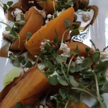 Seasons 52 - Golden beets with goat cheese, roasted pistachios, olive oil and balsamic glaze. - New American Near Me - Altamonte Springs, Florida Seasons 52 - Golden beets with goat cheese, roasted pistachios, olive oil and balsamic glaze. - New American Near Me - Altamonte Springs, Florida