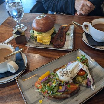 The Corner - Egg sandwich with bacon on the side (instead of inside the sandwich as it usually is). Avocado toast topped with a poached egg. - Breakfast & Brunch Near Me - Glendale, California The Corner - Egg sandwich with bacon on the side (instead of inside the sandwich as it usually is). Avocado toast topped with a poached egg. - Breakfast & Brunch Near Me - Glendale, California
