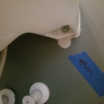 Empire Today - Other side of sink where toggle bolt was pulled through. - Carpet Installation Near Me Empire Today - Other side of sink where toggle bolt was pulled through. - Carpet Installation Near Me