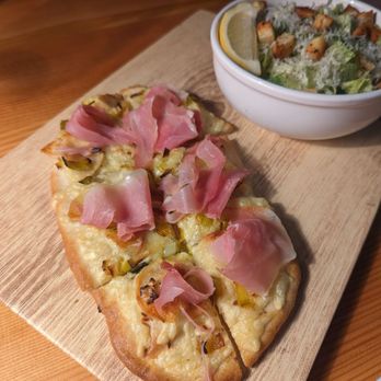 The Beatrice - Prosciutto flatbread special with Caesar Salad - Wine Bars Near Me - Medford, Oregon