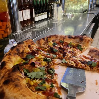 Pie Tap Pizza + Rotisserie + Bar - Chicken BBQ pie served at the bar - Pizza Near Me - Plano, Texas Pie Tap Pizza + Rotisserie + Bar - Chicken BBQ pie served at the bar - Pizza Near Me - Plano, Texas