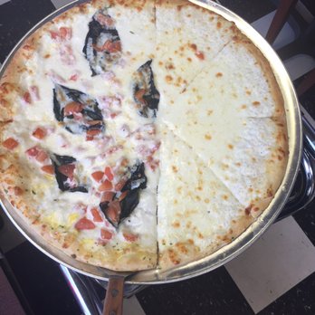 Bella Italia - Half and half plain white pizza with basil and tomato on the other side - Pizza Near Me - Hillsville, Virginia Bella Italia - Half and half plain white pizza with basil and tomato on the other side - Pizza Near Me - Hillsville, Virginia