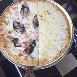 Bella Italia - Half and half plain white pizza with basil and tomato on the other side
