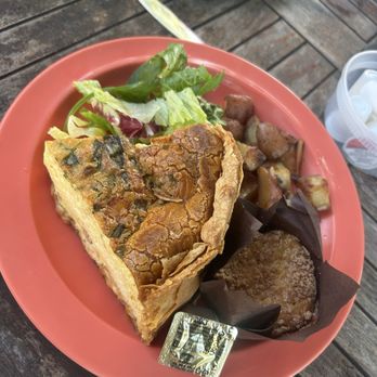 The Wild Iris Café - The quiche, served with home fries and a hot blueberry muffin - Cafes Near Me - Dunedin, Florida The Wild Iris Café - The quiche, served with home fries and a hot blueberry muffin - Cafes Near Me - Dunedin, Florida