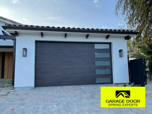 FLUSH DESIGN & CUSTOM GARAGE DOORS 2024 - At Garage Door Spring Experts, based in Upland, CA, we take pride in delivering top-notch custom flush design garage door installations. Serving Upland and the surrounding areas, our team of skilled professionals is dedicated to enhancing your home's curb appeal with sleek, modern garage doors tailored to your specific style and needs. From seamless installations to precise adjustments, we ensure every detail is handled with expertise and care. Trust us to bring both functionality and sophistication to your garage door experience. CALL FOR A FREE ESTIMATE NOW (909) 315 - 3320 FLUSH DESIGN & CUSTOM GARAGE DOORS 2024 - At Garage Door Spring Experts, based in Upland, CA, we take pride in delivering top-notch custom flush design garage door installations. Serving Upland and the surrounding areas, our team of skilled professionals is dedicated to enhancing your home's curb appeal with sleek, modern garage doors tailored to your specific style and needs. From seamless installations to precise adjustments, we ensure every detail is handled with expertise and care. Trust us to bring both functionality and sophistication to your garage door experience. CALL FOR A FREE ESTIMATE NOW (909) 315 - 3320