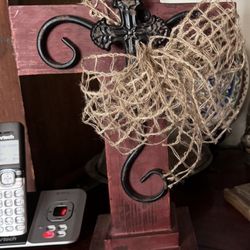 Hidden Treasures Flowers & Gifts - A beautiful wood cross with wrought iron cross overlay and a burlap bow. Sent to a friends funeral.