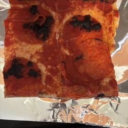 Pica's Restaurant - Burnt pizza.  Already pulled off a big piece of burnt sauce before taking this picture.